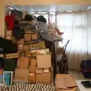 brown cardboard boxes on black steel rack