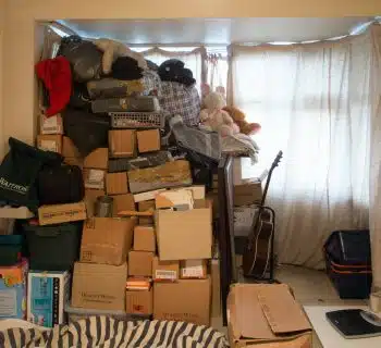 brown cardboard boxes on black steel rack