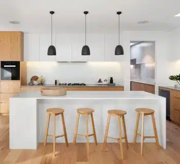 brown wooden seat beside white wooden table